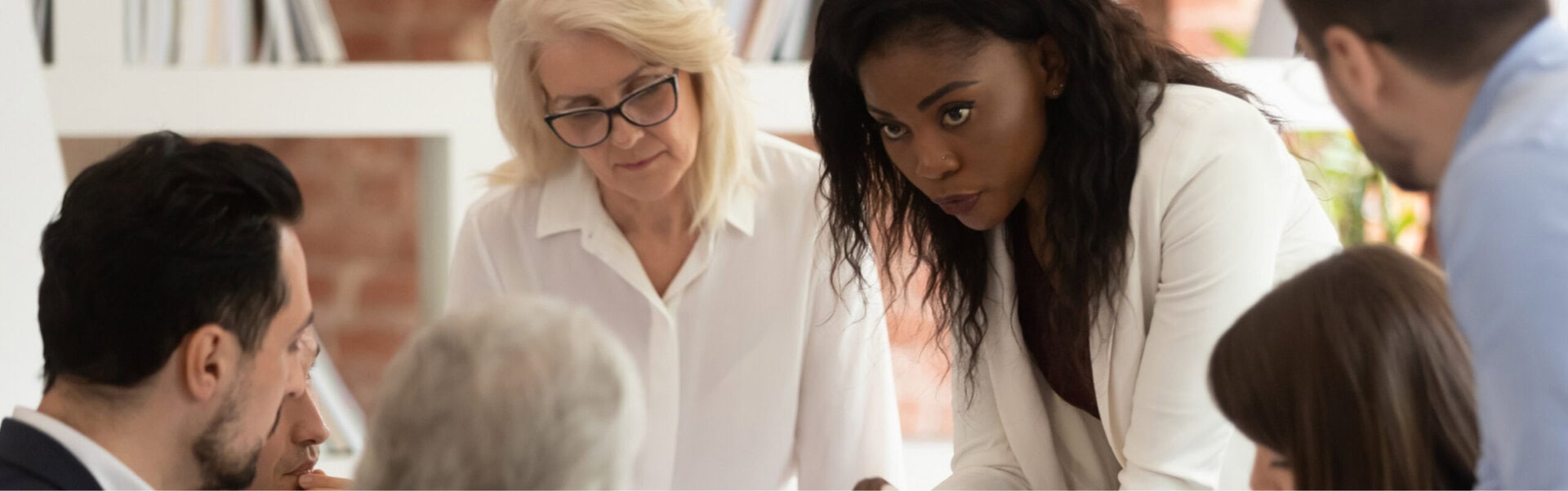 Employees engage in a conversation about leadership development.