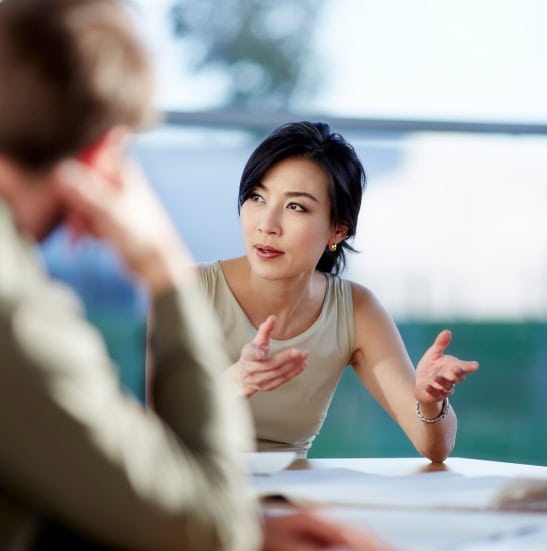 A woman offers career coaching advice to others