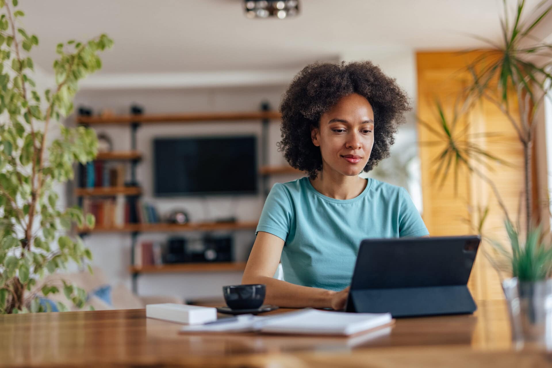 Woman cleaning her messages folder, at home office